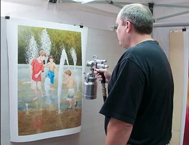 Artfinity canvas being spray varnished to protect it in Sarasota FL